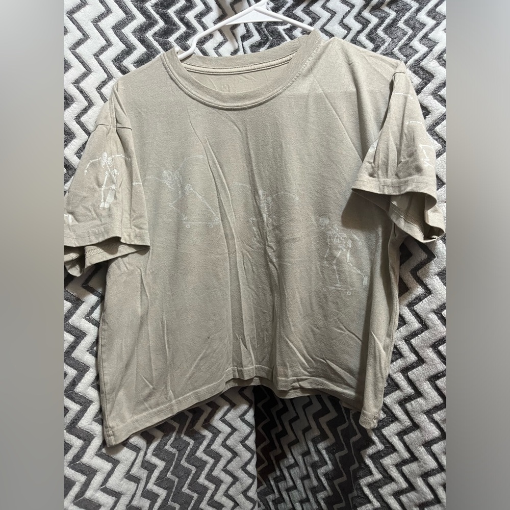 Neutral Beige Graphic Crop Tee with skeletons skateboarding